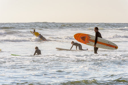 SWAKOPMUND, NAMIBIA - JAN 5, 2016: Unidentified surfer on the Atlantic coast of Swakopmund. It was found in 1892 as the main harbour for German South-West Africaのeditorial素材
