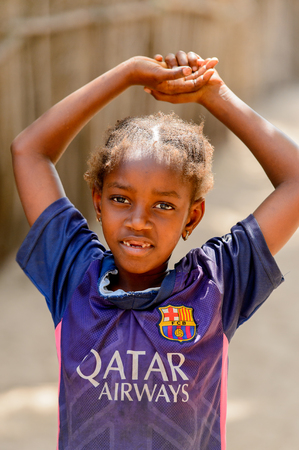 KASCHOUANE, SENEGAL - APR 29, 2017: Unidentified Diola girl raises her hands in Kaschouane village. Diolas are the ethnic group predominate in the region of Casamanceのeditorial素材