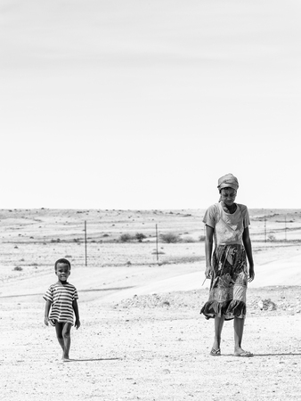 SWAKOPMUND, NAMIBIA - JAN 5, 2016:  Unidentified Ovambo little boy and his mother in Namibia.  Ovambo is the most popular ethnic groupのeditorial素材