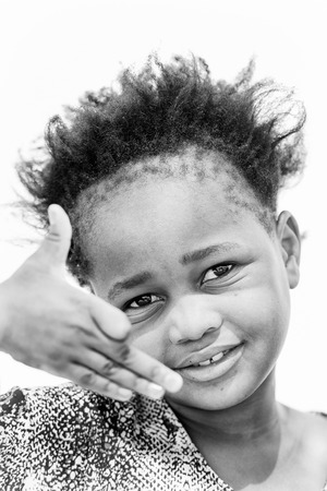 WINDHOEK, NAMIBIA - JAN 3, 2016: Unidentified Ovambo smiling girl in Namibia.  Ovambo is the most popular ethnic groupのeditorial素材