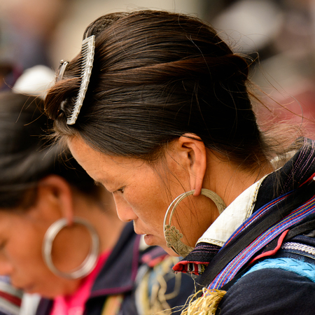 SAPA, VIETNAM - SEP 20, 2014: Unidentified Hmong woman in the Hmong traditional costume portrait. Hmong people is a minority ethnic group living in Sapaのeditorial素材