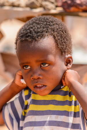 SWAKOPMUND, NAMIBIA - JAN 5, 2016:  Unidentified Ovambo little boy in Namibia.  Ovambo is the most popular ethnic groupのeditorial素材