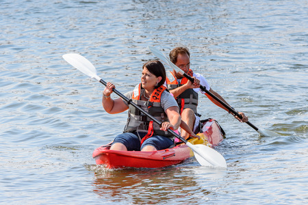 SWAKOPMUND, NAMIBIA - JAN 5, 2016: Unidentified tourist swim in the boat on the Atlantic coast of Swakopmund. It was found in 1892 as the main harbour for German South-West Africaのeditorial素材