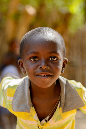 KASCHOUANE, SENEGAL - APR 29, 2017: Unidentified Diola little boy looks ahead in Kaschouane village. Diolas are the ethnic group predominate in the region of Casamanceのeditorial素材