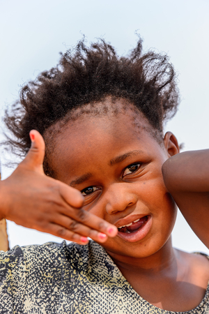 WINDHOEK, NAMIBIA - JAN 3, 2016: Unidentified Ovambo smiling girl in Namibia.  Ovambo is the most popular ethnic groupのeditorial素材