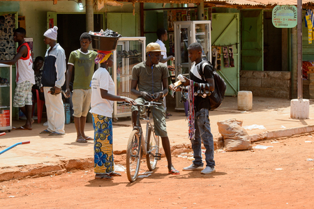 CANCHUNGO, GUINEA BISSAU - MAY 3, 2017: Unidentified local people talk about something in the centre of Canchungo, one of the major cities of the countryのeditorial素材
