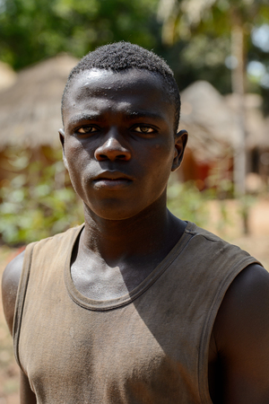 CANHABAQUE, GUINEA BISSAU - MAY 4, 2017: Unidentified local boy looks ahead in a village of the Canhabaque island. People in G.-Bissau still suffer of povertyのeditorial素材