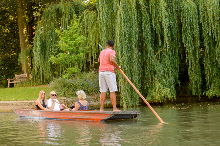 CAMBRIDGE, ENGLAND - JULY 19, 2016: Unidentified man sails in a boat over the river Cam, Cambridge, England. The original name was the Granta riverのeditorial素材