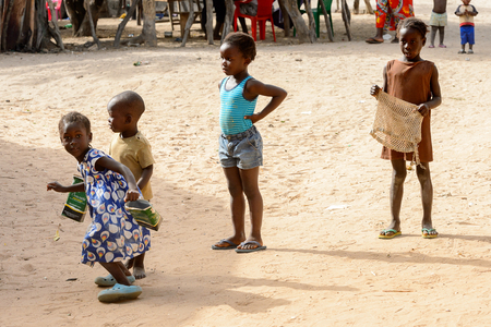ORANGO ISLAND, GUINEA BISSAU - MAY 3, 2017: Unidentified local children play in the Etigoca village. People in G.-Bissau suffer of poverty due to the bad economyのeditorial素材