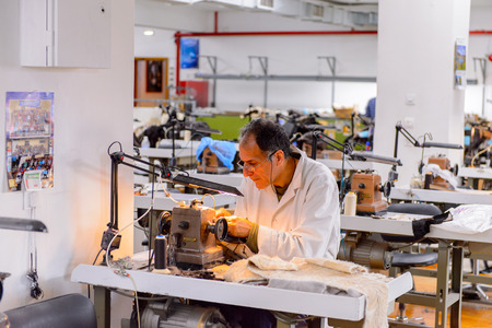 GREECE - APR 22, 2016: Fur coat making factory of Papandopulos in Kastoria, Greece. Very populat brand of Greek made fir coatsのeditorial素材