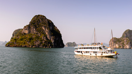 HA LONG BAY, VIETNAM - SEP 23, 2014: TOuristic junk navigating in the Halong bay, Vietnam. UNESCO World Heritageのeditorial素材