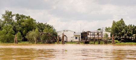 TIEN GIANG, VIETNAM - OCT 5, 2014: Mekong river in Southern Vietnam. Mekong is the 12th-longest river and flows trough China, Burma, Laos, Thailand, Cambodia, Vietnamのeditorial素材