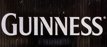 DUBLIN, IRELAND - JULY 12, 2016: Guinnes logo on the entrance gate to the  Brewery. Guinness is an Irish dry stout produced by Diageo originated in the brewery of Arthur Guinnessのeditorial素材