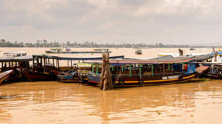 TIEN GIANG, VIETNAM - OCT 5, 2014: Touristic boat on the Mekong river in Southern Vietnam. Mekong is the 12th-longest river and flows trough China, Burma, Laos, Thailand, Cambodia, Vietnamのeditorial素材