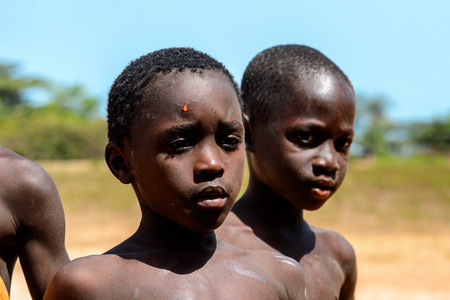 BUBAQUE, GUINEA BISSAU - MAY 5, 2017: Unidentified local little boy stands in a village of the...