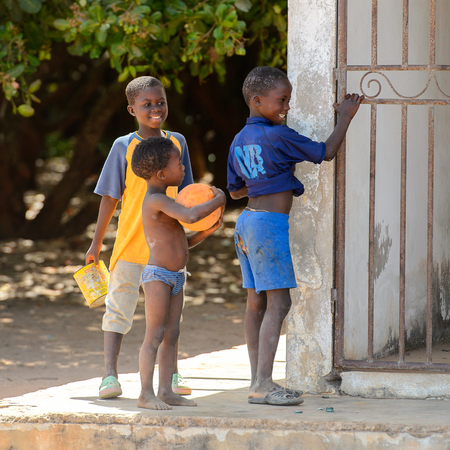 BUBAQUE, GUINEA BISSAU - MAY 5, 2017: Unidentified local children play on the street in a village of the Bubaque island. People in G.-Bissau still suffer of povertyのeditorial素材
