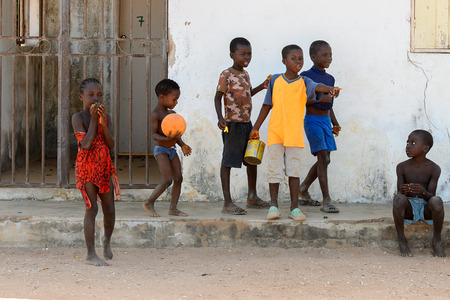 BUBAQUE, GUINEA BISSAU - MAY 5, 2017: Unidentified local children play on the street in a village of the Bubaque island. People in G.-Bissau still suffer of povertyのeditorial素材