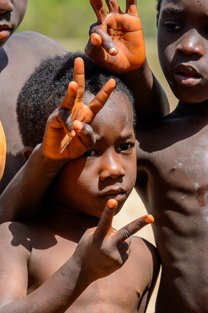 BUBAQUE, GUINEA BISSAU - MAY 5, 2017: Unidentified local children stand in a village of the Bubaque island. People in G.-Bissau still suffer of povertyのeditorial素材