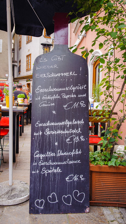 GRAZ, AUSTRIA - JUN 27, 2014: Menu of a restarant in the area called 'Bermuda Triangle' in Graz, Austria. Graz is the capital of federal state of Styria and the second largest city in Austriaのeditorial素材