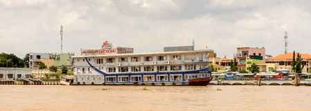 TIEN GIANG PROVINCE, VIETNAM - OCT 5, 2014: Boats on the Mekong river in Southern Vietnam. Mekong is the 12th-longest river and flows trough China, Burma, Laos, Thailand, Cambodia, Vietnamのeditorial素材