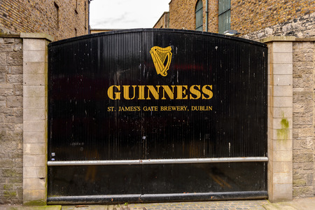 DUBLIN, IRELAND - JULY 12, 2016: Guinnes logo on the entrance gate to the  Brewery. Guinness is an Irish dry stout produced by Diageo originated in the brewery of Arthur Guinnessのeditorial素材