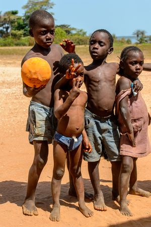 BUBAQUE, GUINEA BISSAU - MAY 5, 2017: Unidentified local children stand in a village of the Bubaque island. People in G.-Bissau still suffer of povertyのeditorial素材
