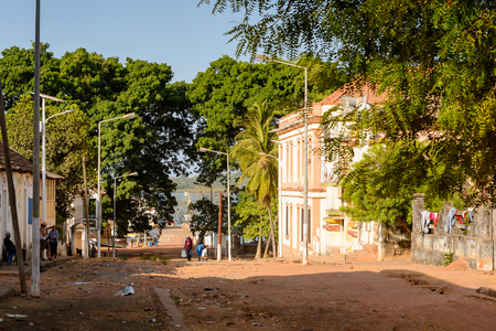 BOLAMA ISLAND, GUINEA BISSAU - MAY 6, 2017: Unidentified local people walk along the street in the ghost town of Bolama, the former capital of Portuguese Guineaのeditorial素材