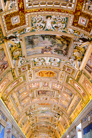 VATICAN, VATICAN CITY - MAY 7, 2016: Paintings on the walls and the ceiling  in the Gallery of Maps, at the Vatican Museum. It was established in 1506のeditorial素材