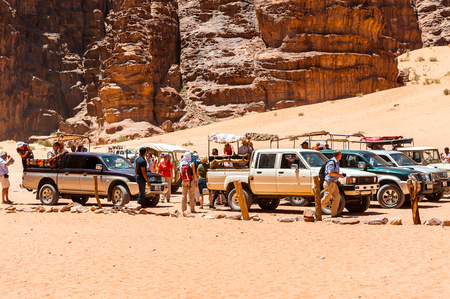 WADI RUM, JORDAN - APR 30, 2014: Touristic jeeps for the tourists in the desert of Wadi Rum. Wadi Rum valley is the UNESCO World Heritage siteのeditorial素材