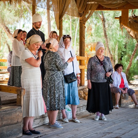 JESUS CHRIST BAPTISM SITE , JORDAN - MAY 1, 2014: Unidentified  Russian ladies near the Sacred water of the River Jordan. River where Jesus of Nazareth was baptized by John the Baptist.のeditorial素材