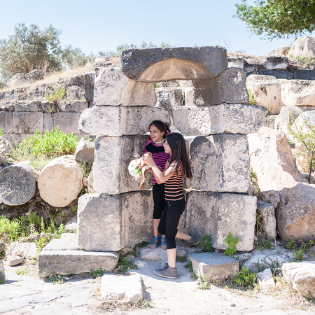 GADARA, JORDAN - MAY 2, 2014: Unidentified tourists in the ancient town of Gadara, Jordan. By the third century BC the Gadara town was of some cultural importance.のeditorial素材