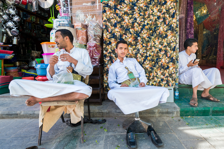 SANA'A, YEMEN - JAN 11, 2014: Unidentified Yemeni man works at the market in Sana'a. People of Yemen suffer of poverty due to the unstable political and poor economical situationのeditorial素材