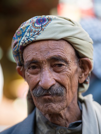 SANA'A, YEMEN - JAN 11, 2014: Unidentified Yemeni man in a turban in Sana'a. People of Yemen suffer of poverty due to the unstable political and poor economical situationのeditorial素材