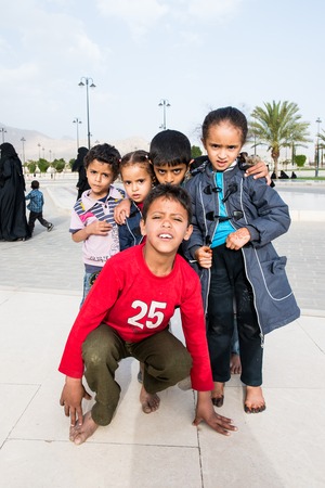 SANA'A, YEMEN - JAN 11, 2014: Unidentified Yemeni children play near the Al Saleh Mosque in Sana'a. Children of Yemen grow up without educationのeditorial素材