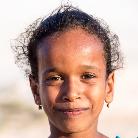 SOCOTRA, YEMEN - JAN 12, 2014: Unidentified Yemeni little girl portrait on  the beach of the Island...