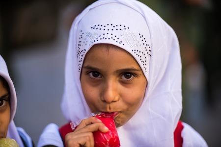 SANA'A, YEMEN - JAN 11, 2014: Unidentified Yemeni beautiful girl in the street in Sana'a. Children...