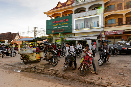 SIEM REAP, CAMBODIA - SEP 28, 2014: Unidentified people on motorbikes in Siemreap region, Cambodia. Siem Reap is the capital city of Siem Reap Province and a popular resort town as the gateway to Angkor regionのeditorial素材