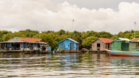 LAKE TONLE SAP, COMBODIA - SEP 28, 2014: Boats and houses of the Chong Knies Village on the Tonle Sap Lake, the largest freshwater lake in Southeast Asia, a UNESCO biosphere since 1997のeditorial素材