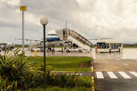 SIEM REAP, CAMBODIA - SEP 26, 2014: China southern plane during boarding process at the Siemreap International Airport. It is the busiest airport in Cambodia in terms of passenger traffic.のeditorial素材