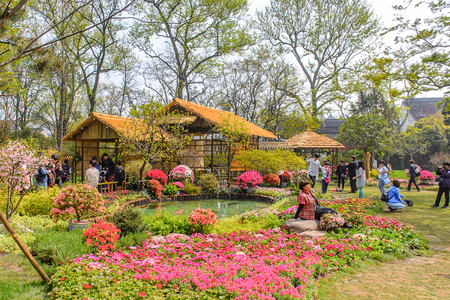 SUZHOU, CHINA - APR 1, 2016: Unidentified tourists at the The Humble Administrator's Garden,  a Chinese garden in Suzhou, a UNESCO World Heritage Siteのeditorial素材