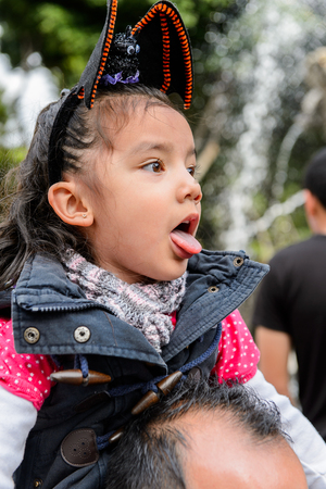PUEBLA, MEXICO - OCT 30, 2016: Unidentified girl dressed for the Day of the Dead (Dia de los Muertos), national Mexican holiday, UNESCO Intangible Cultural Heritage of Humanityのeditorial素材