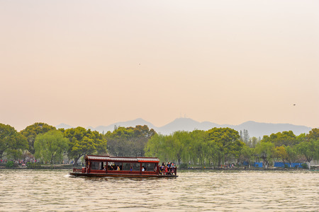 HANGZHOU, CHINA - APR 2, 2016: Traditional Chinese boat at the West Lake (Xi hu lake) is a freshwater lake in Hangzhou. UNESCO World Heritage Site
(West Lake Cultural Landscape of Hangzhou)のeditorial素材