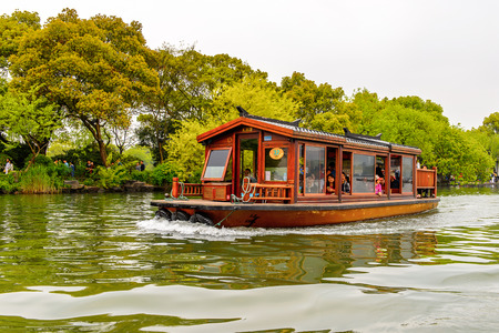 HANGZHOU, CHINA - APR 2, 2016: Traditional Chinese boat at the West Lake (Xi hu lake) is a freshwater lake in Hangzhou. UNESCO World Heritage Site
(West Lake Cultural Landscape of Hangzhou)のeditorial素材