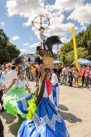 OAXACA, MEXICO - OCT 31, 2016: Unidentified girl dances with a basket for the Day of the Dead (Dia de los Muertos), national Mexican holiday, UNESCO Intangible Cultural Heritage of Humanityのeditorial素材