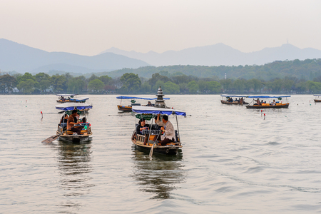 HANGZHOU, CHINA - APR 2, 2016: Traditional Chinese boat at the West Lake (Xi hu lake) is a freshwater lake in Hangzhou. UNESCO World Heritage Site
(West Lake Cultural Landscape of Hangzhou)のeditorial素材