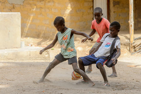 ORANGO ISLAND, GUINEA BISSAU - MAY 3, 2017: Unidentified local boys play football on the Orange islandのeditorial素材