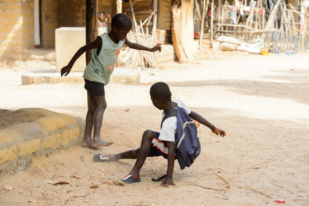 ORANGO ISLAND, GUINEA BISSAU - MAY 3, 2017: Unidentified local boys play football on the Orange islandのeditorial素材