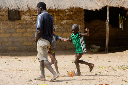 ORANGO ISLAND, GUINEA BISSAU - MAY 3, 2017: Unidentified local boys play football on the Orange islandのeditorial素材