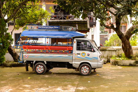 LUANG PRABANG, LAOS - SEP, 25, 2014: Local taxi cab tuk-tuk in Luang Prabang, local way of transportationのeditorial素材