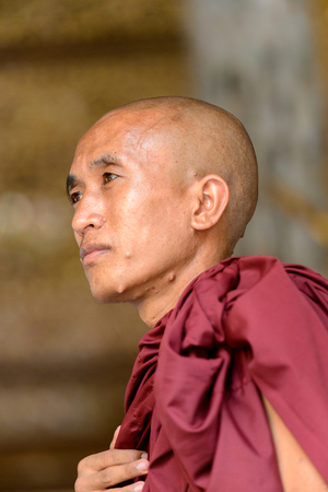 YANGON, MYANMAR - AUG 24, 2016: Unidentified Burmese Buddhist monk portrait. 68 per cent of Myanma people belong to Bamar ethnic groupのeditorial素材
